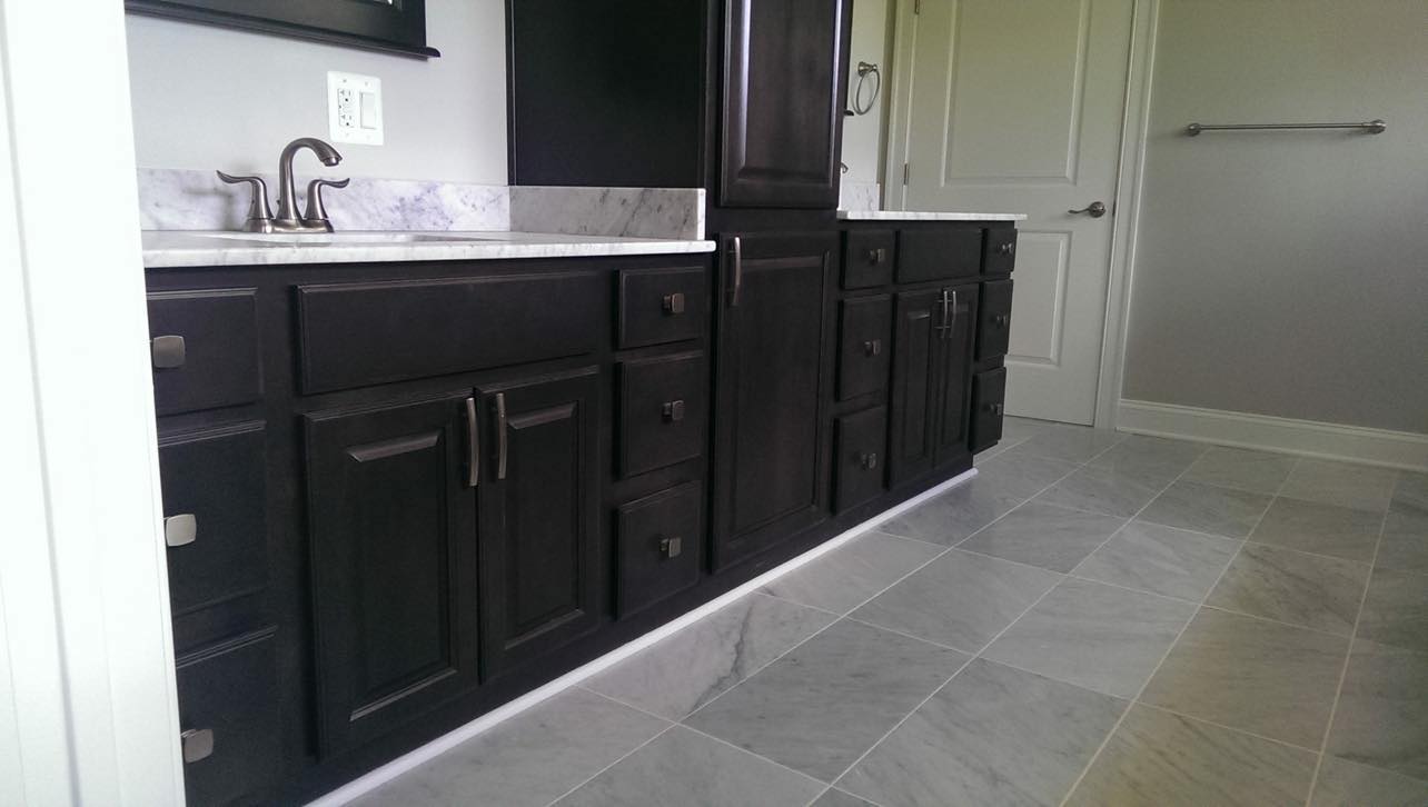 Bathroom remodeling project with updated fixtures by Maressa Remodeling