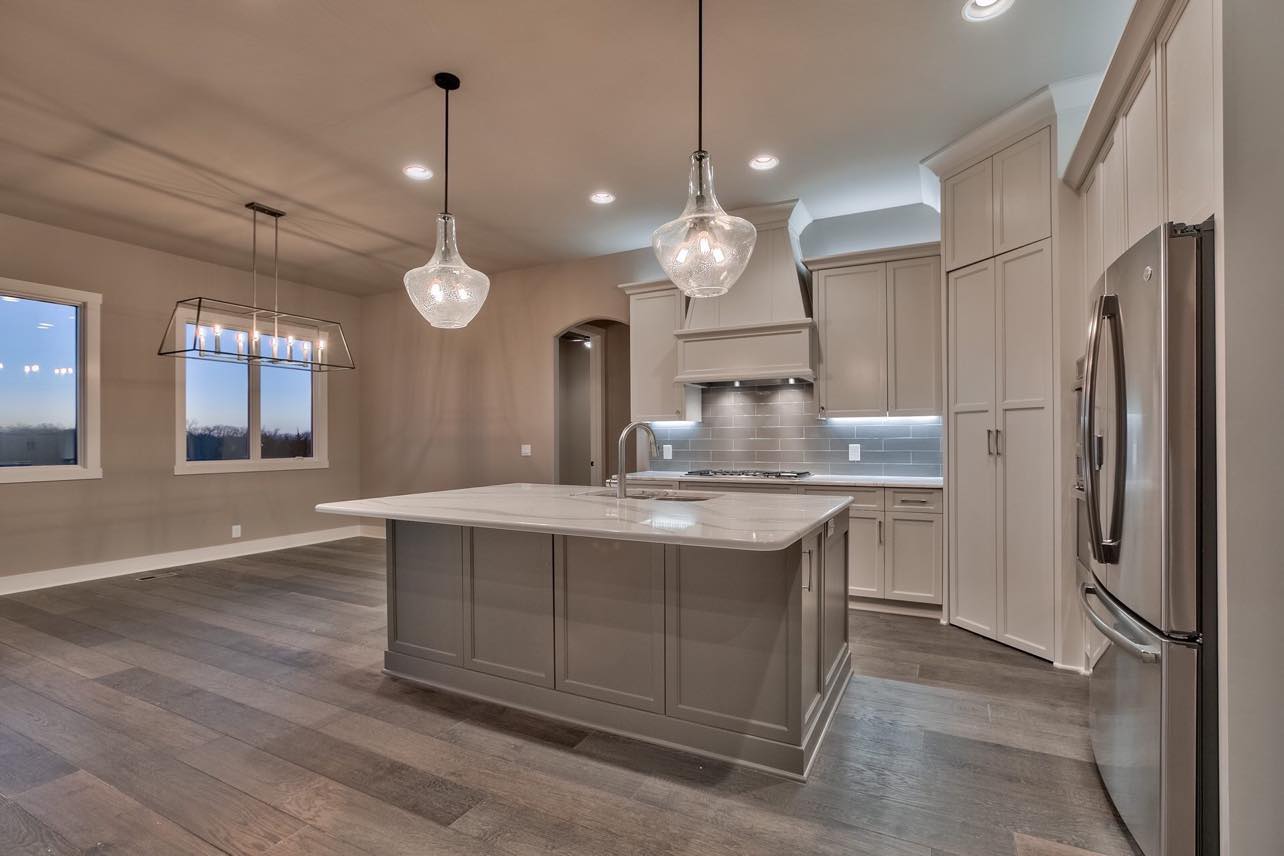 Kitchen remodeling project with new cabinets and flooring by Maressa Remodeling